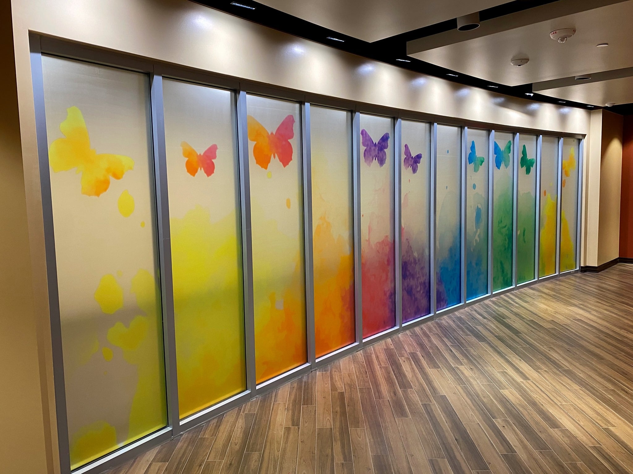 Translucent vinyl with matte finish laminate spanning 12 window panes for Family & Children's Services.